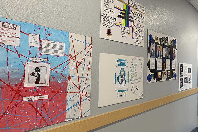 student projects of artists on wall