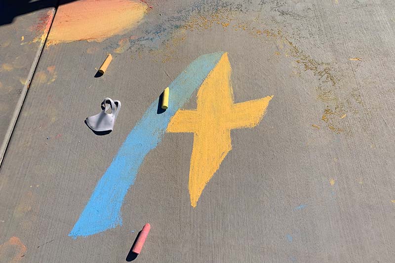Chalk drawing of A+ Charter logo
