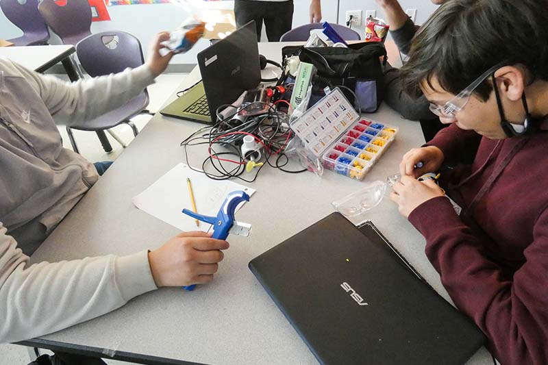Students working on electronic components