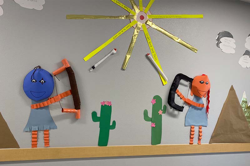 art figurines of archers and cacti 