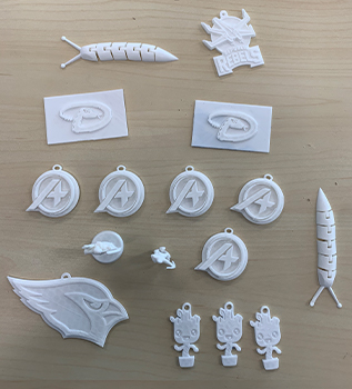 a bundle of 3-d printed keychains